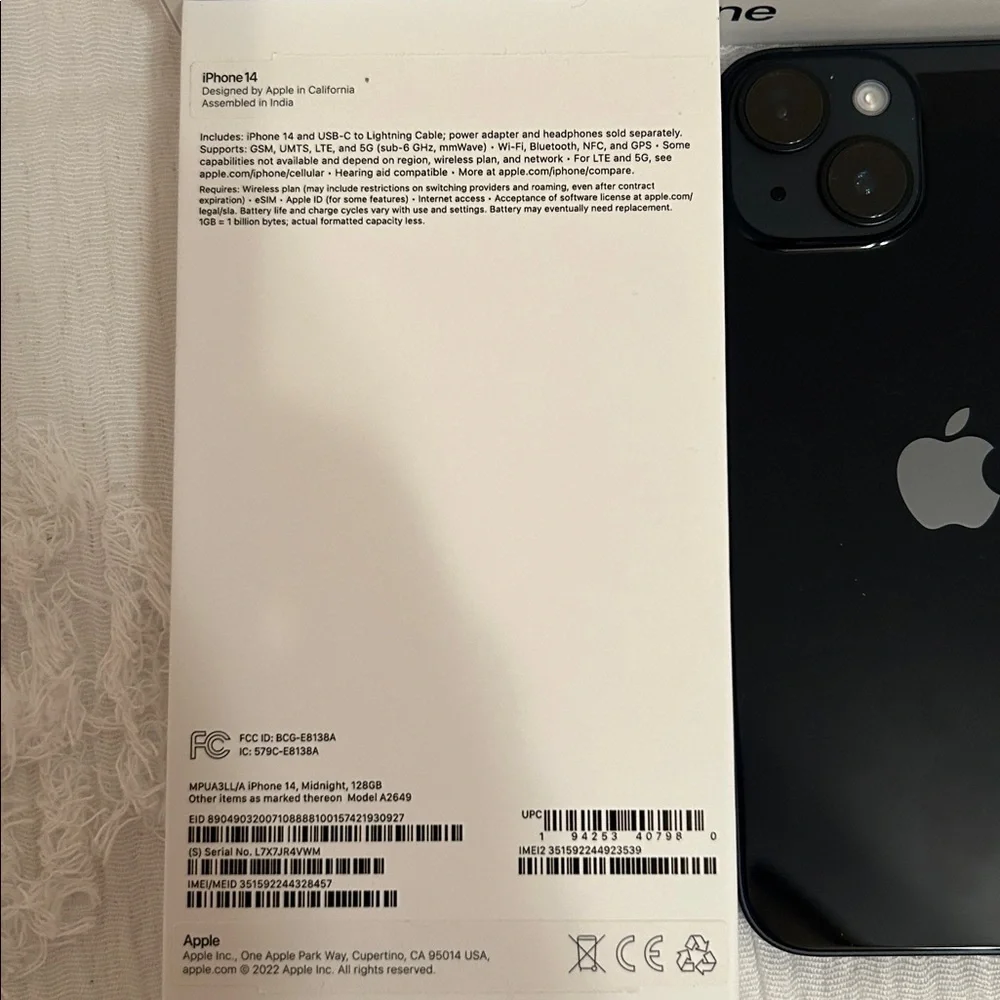 Apple iPhone with Black Screen and White Packaging